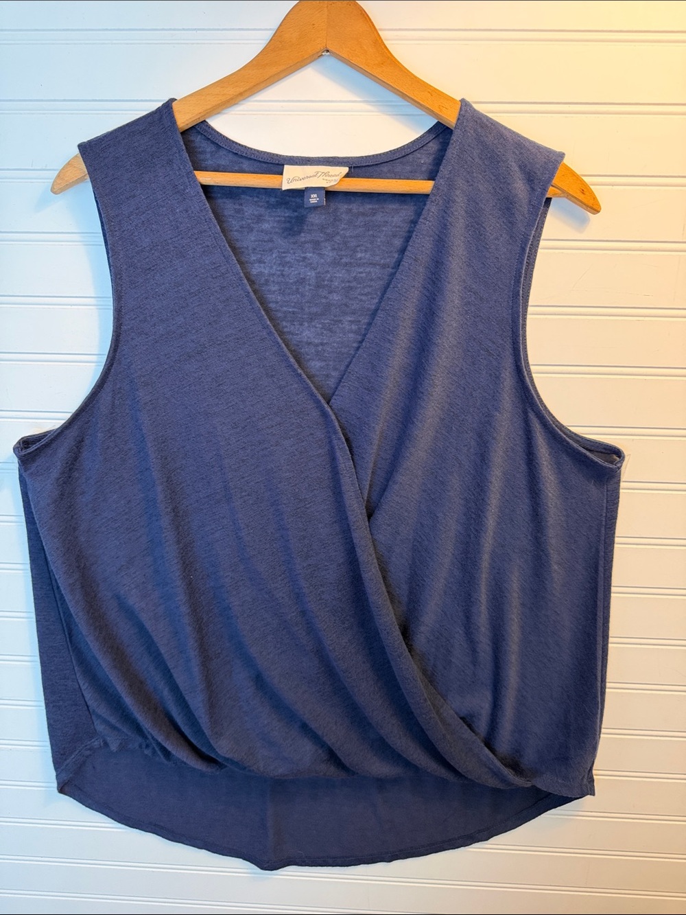 Navy blue, sleeveless V-neck blouse/ shirt
Universal Thread front balloon drape